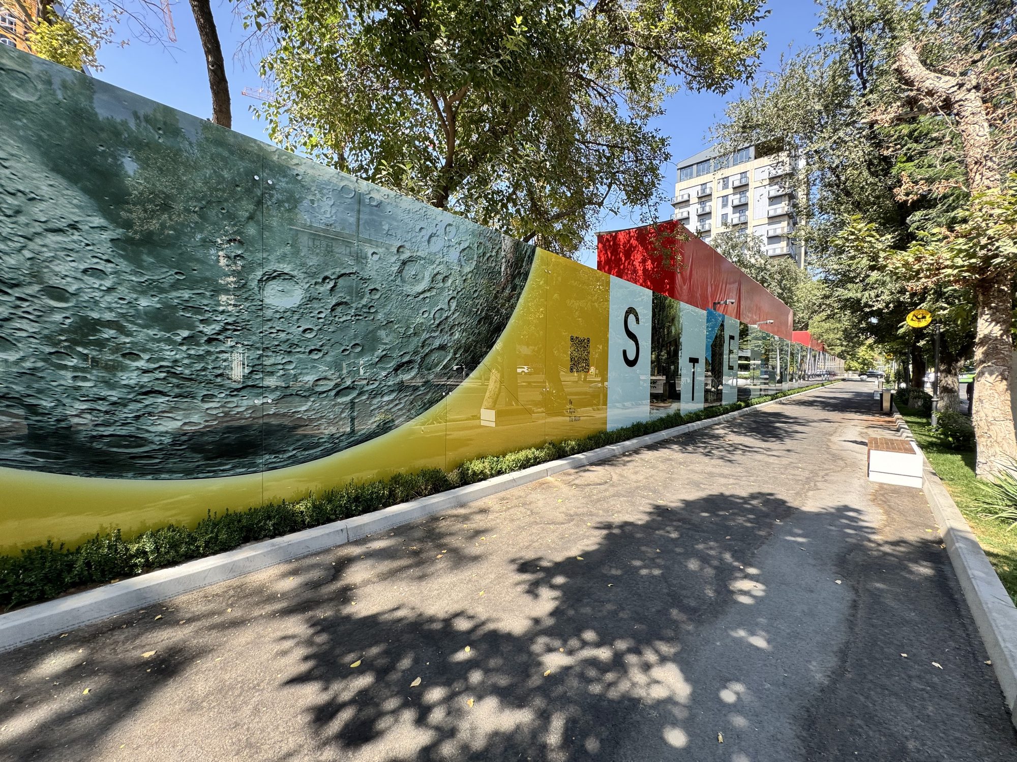 Architectural artwork printed on glass hoarding panels in Tashkent
